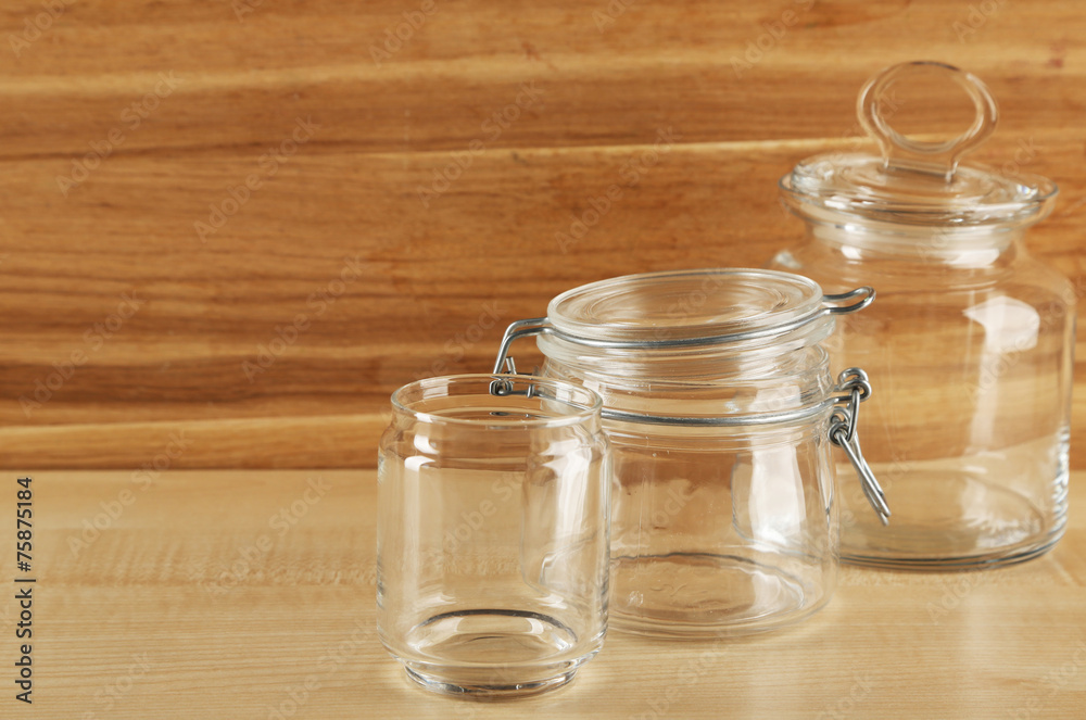 Set of empty glassware on wooden background Set of empty glassware on wooden background