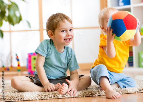 children play with ball indoor