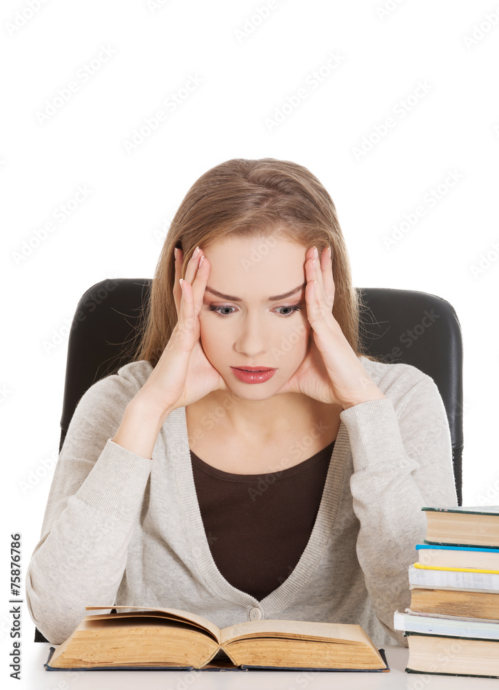 Thoughtful woman learning to exam Thoughtful woman learning to exam