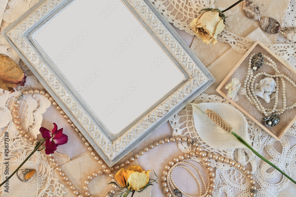 Old frame with beads and with dried roses. Old frame with beads and with dried roses.