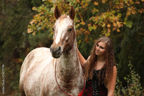 Amazing girl standing next to the appaloosa horse © Zuzana Tillerova