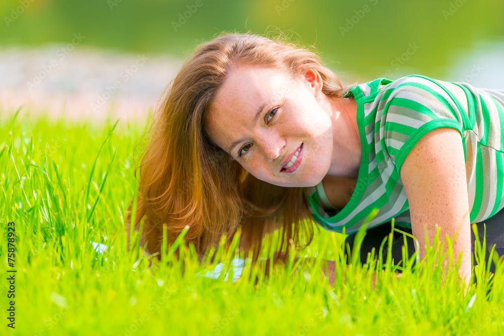 Portrait of charming girl in green t-shirt on the grass Portrait of charming girl in green t-shirt on the grass