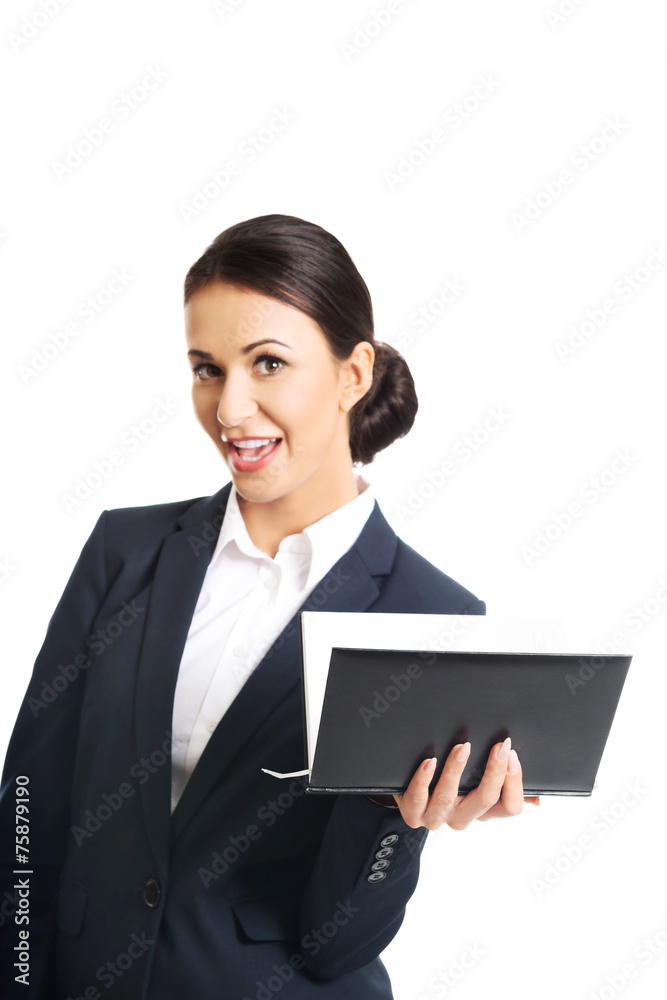 Portrait of businesswoman holding her notes Portrait of businesswoman holding her notes