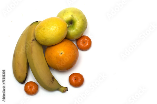 Fruits - banana  apple  orange  lemon and tangerine. Photo.