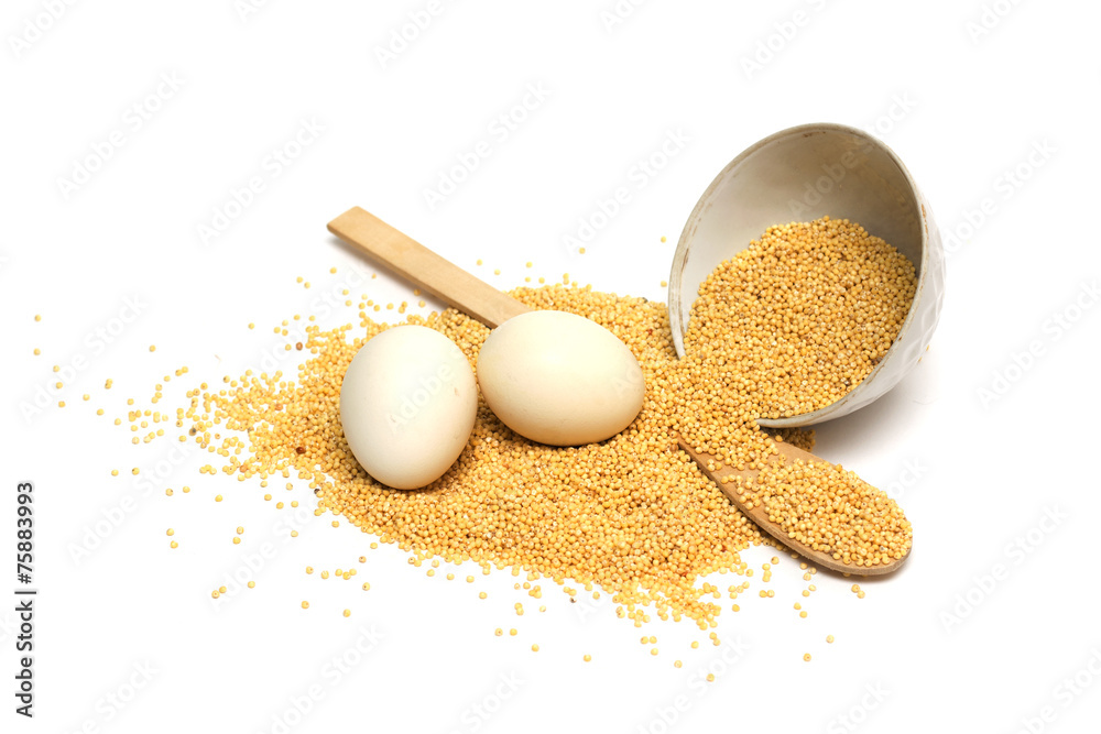 Saucer with cereal, eggs and a wooden spoon. Photo. Saucer with cereal, eggs and a wooden spoon. Photo.