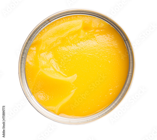 Indian ghee in a tin can over white background photo
