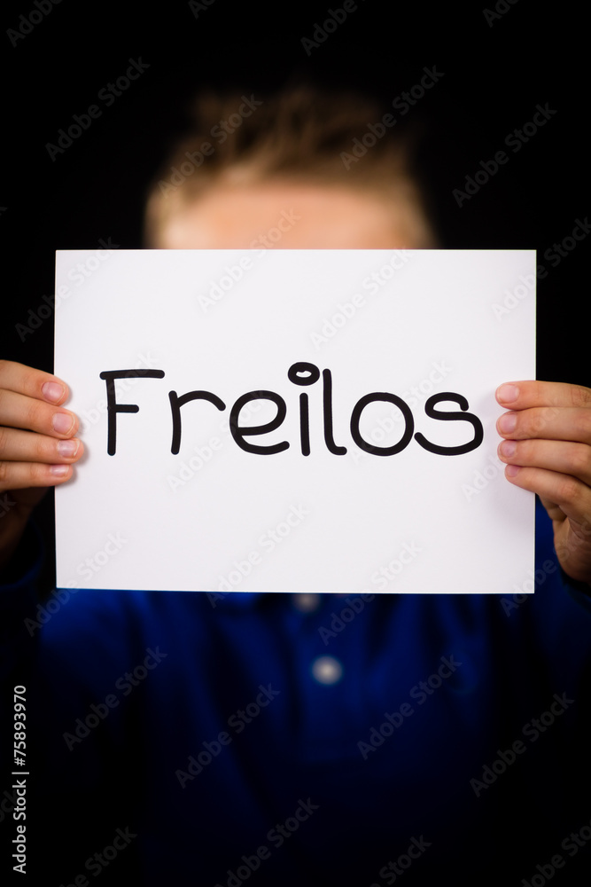 Child holding sign with German word Freilos - See You Later Child holding sign with German word Freilos - See You Later