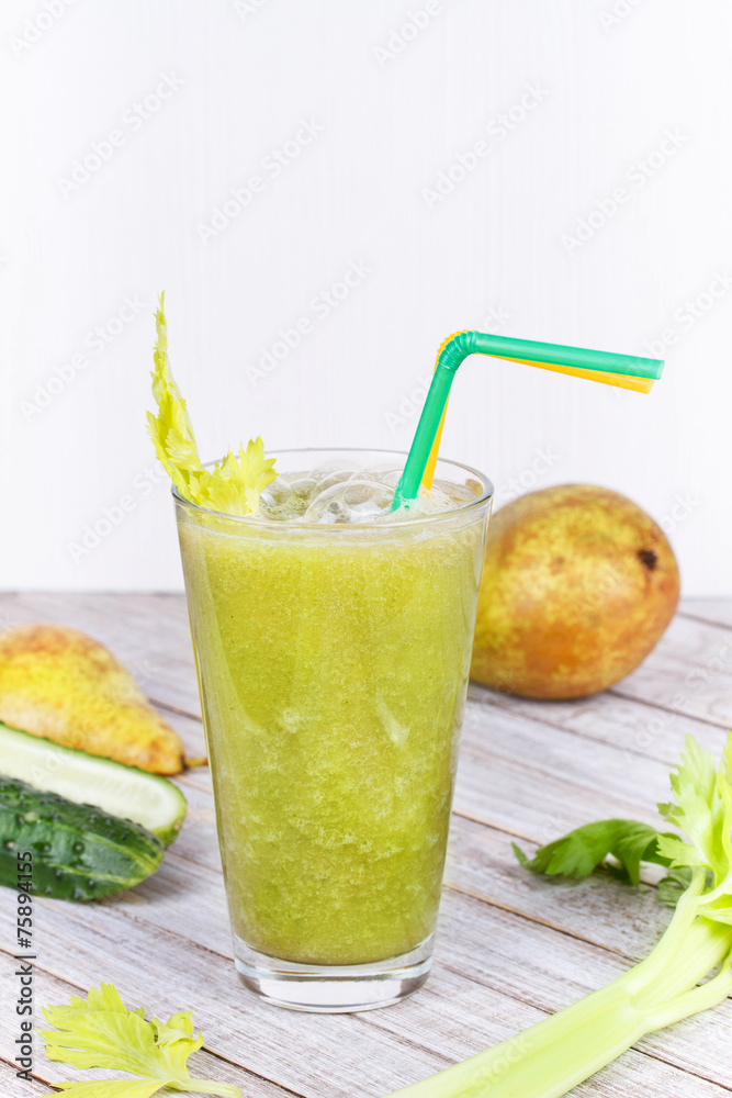 Fototapeta premium Cucumber, pear and celery juice. Slices of fruits and vegetables