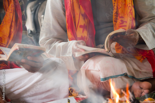 Brahmin reading hindu puja in Nepal photo