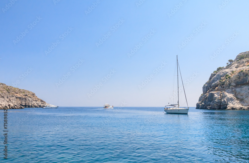 Yacht in the blue sea. Rhodes Island. Greece Yacht in the blue sea. Rhodes Island. Greece
