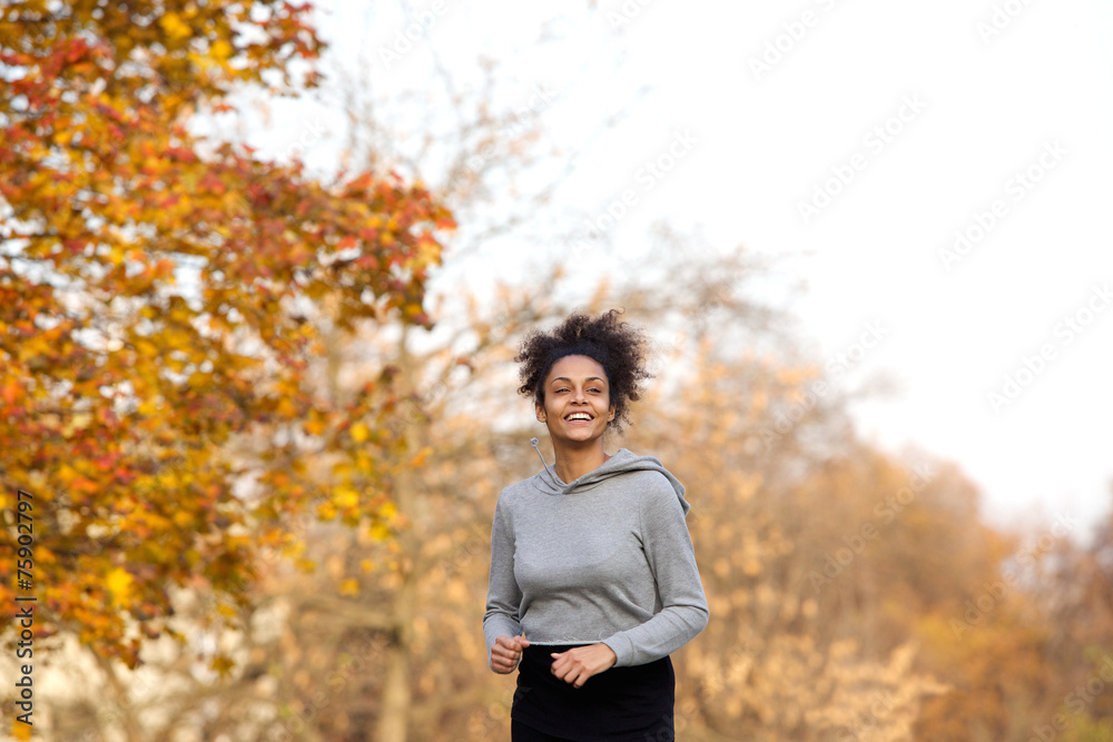 Young sports woman running in the park Young sports woman running in the park