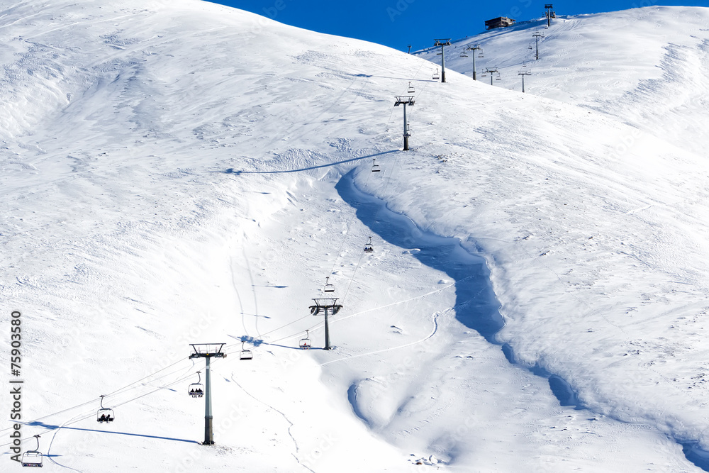 Aerial View of ski lifts over the snowed mountain Aerial View of ski lifts over the snowed mountain
