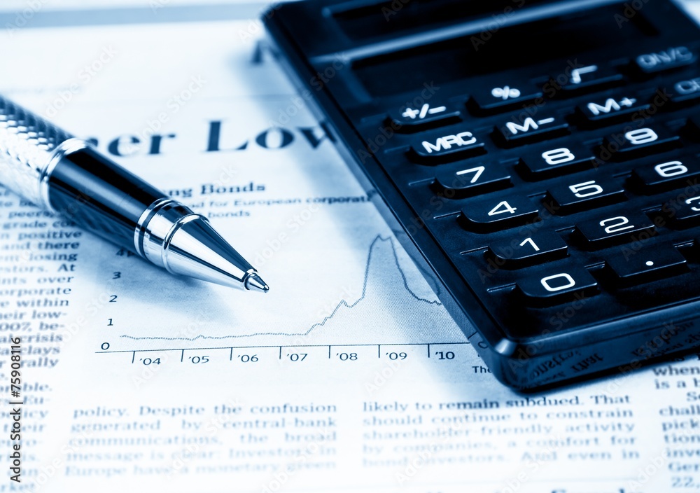 financial chart and graph near pen and calculator financial chart and graph near pen and calculator