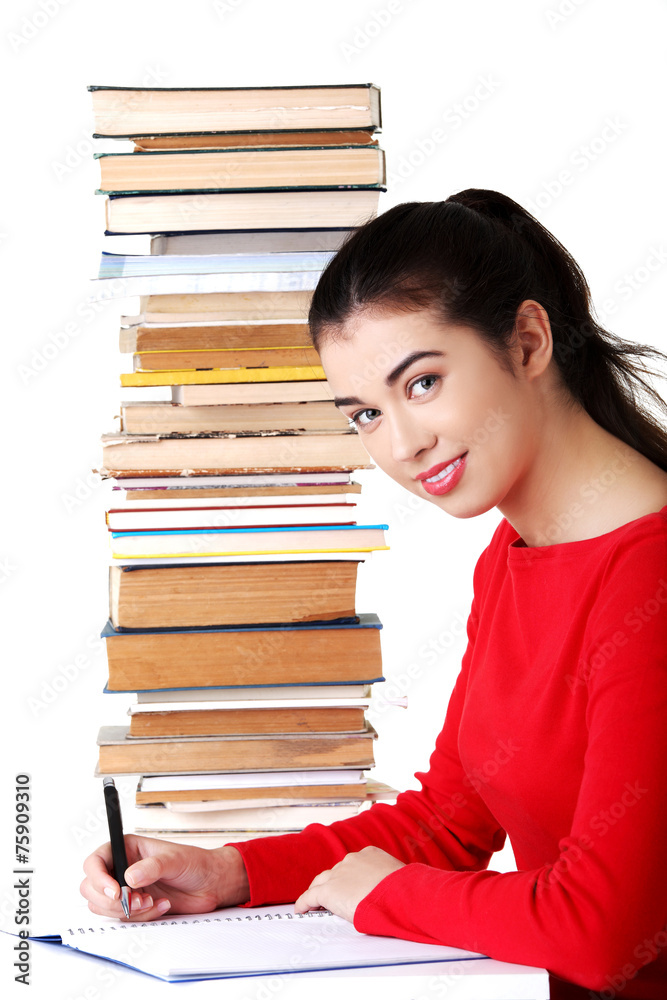 Side view woman sitting with stack of books Side view woman sitting with stack of books