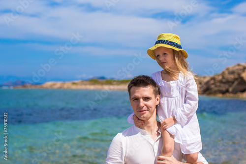 Adorable little girl and happy father during beach vacation © travnikovstudio