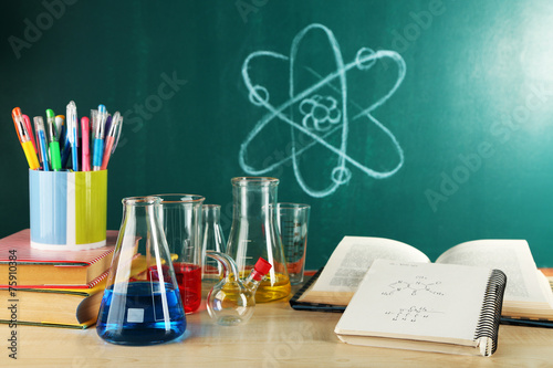 Desk in chemistry class with test tubes photo