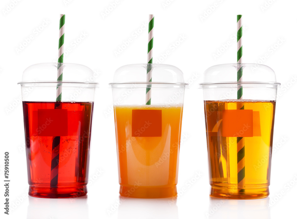 Fruit juices in fast food closed cups with tubes isolated Fruit juices in fast food closed cups with tubes isolated