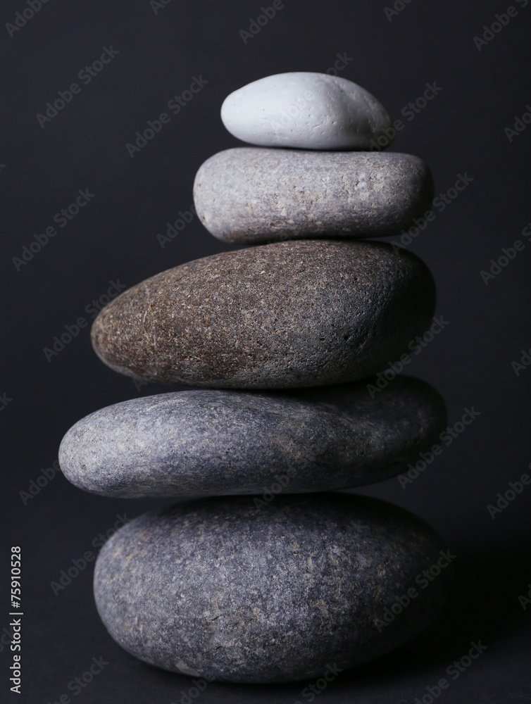 Pyramid of spa stones on dark background Pyramid of spa stones on dark background