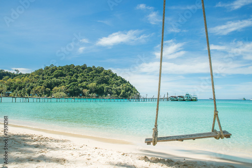 Swing hang from coconut tree over beach sea. Travel in Phuket T
