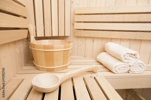 Detail of bucket and white towels in a sauna © lusia83