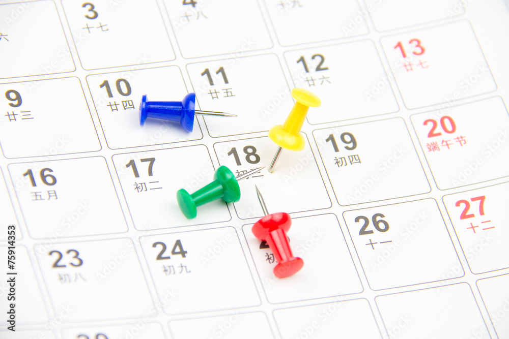 Thumb tack on calendar page