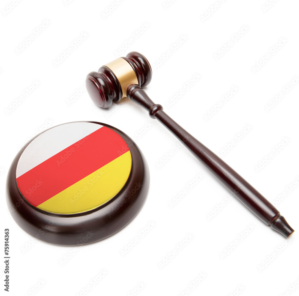 Judge gavel and soundboard with flag on it - South Ossetia