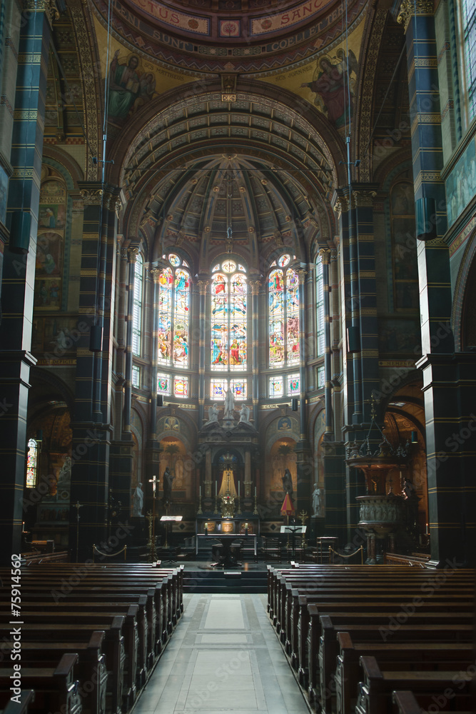 Basilica of St. Nicholas across from the Amsterdam Train Station. The beautiful stained glass windows, and ornate walls invite the faithful. Basilica of St. Nicholas across from the Amsterdam Train Station. The beautiful stained glass windows, and ornate walls invite the faithful.