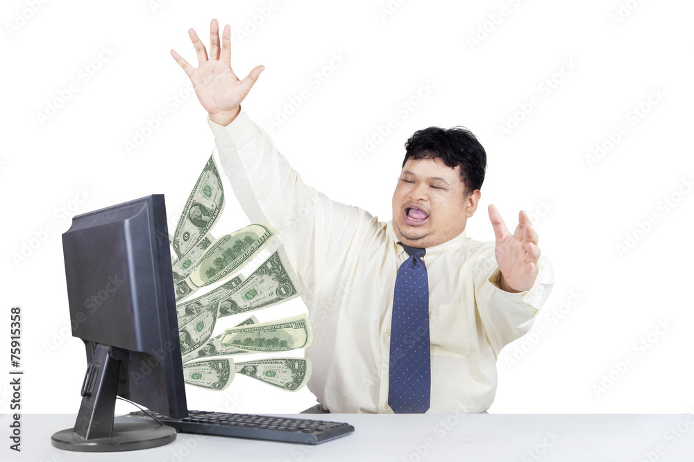 Successful businessman with money from computer Successful businessman with money from computer