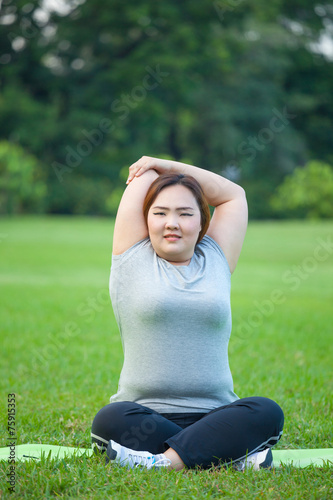 Happy fatty woman posing outdoor © witthaya