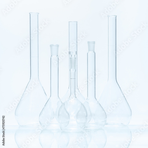 Set of six empty flat-bottomed flasks of different capacity for