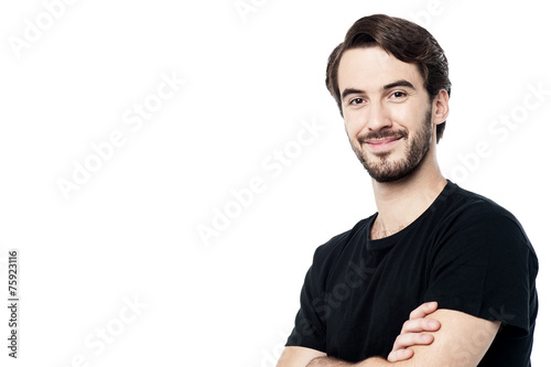 Handsome man posing with folded arms