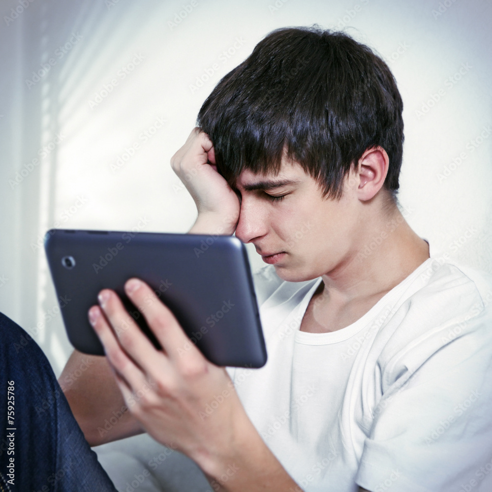 Sad Young Man with Tablet Sad Young Man with Tablet