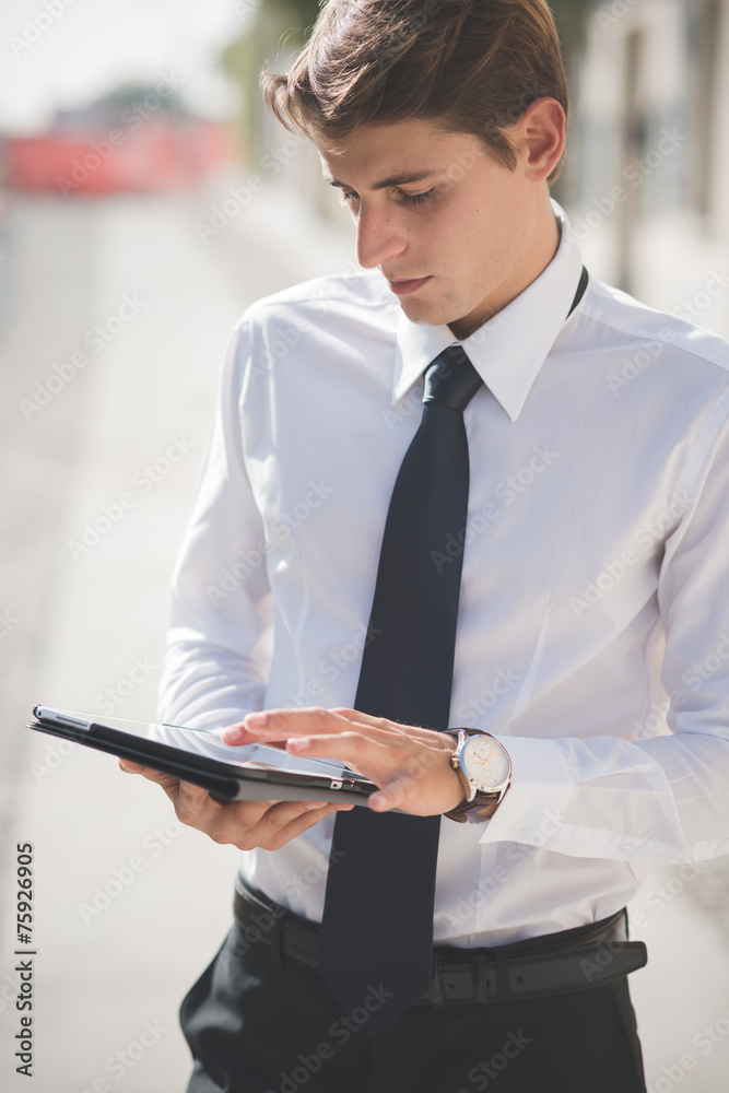 young handsome elegant blonde model man using tablet young handsome elegant blonde model man using tablet