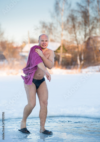 cheerful man after swimming cold water