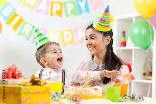 child and his mom have fun on birthday