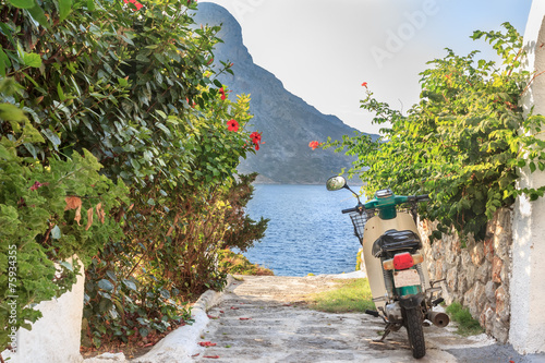 Fototapeta Naklejka Na Ścianę i Meble -  Green street scooter on Greek Kalymnos island