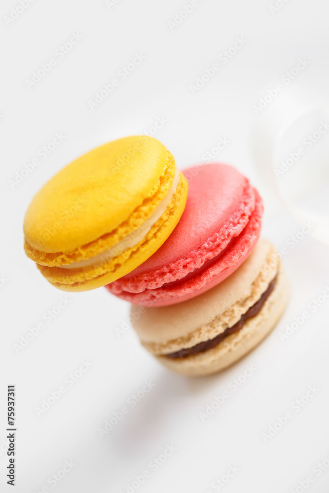 Colorful French pastry on a white background.