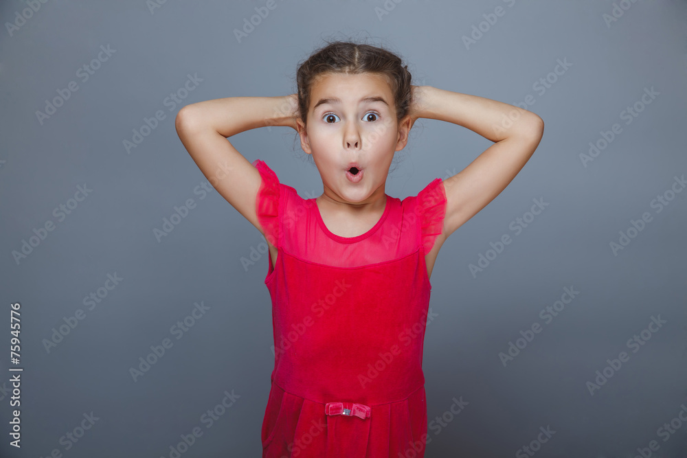 © maxximmm - baby girl joy delight in a red dress on gray background