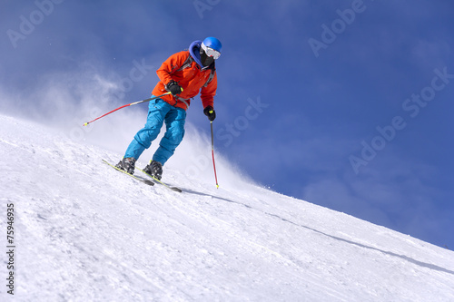 Skier skiing downhill
