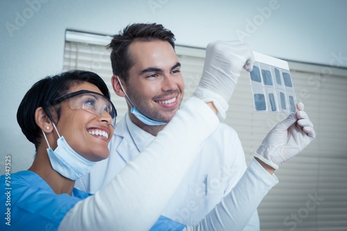 Dentists looking at x-ray