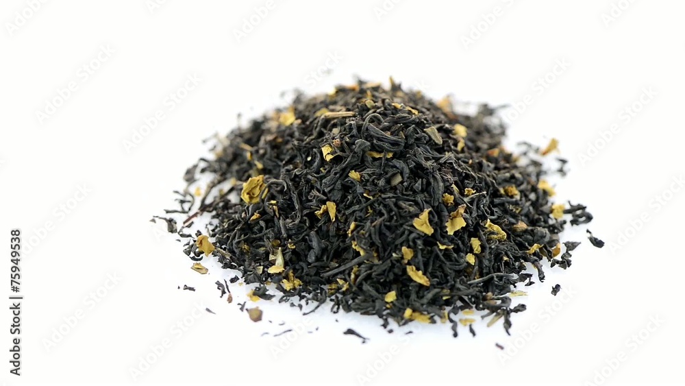 Aromatic black dry tea with petals, isolated on white Aromatic black dry tea with petals, isolated on white