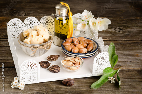 Argan oil and fruits with Shea butter and nuts photo