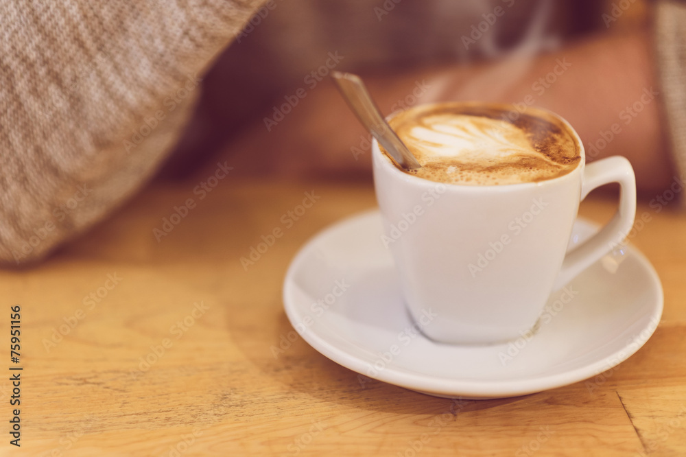 Fototapeta premium unrecognizable man drinking coffee and having breakfast.