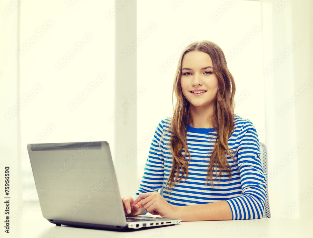 smiling teenage gitl with laptop computer at home smiling teenage gitl with laptop computer at home
