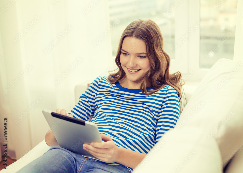 smiling teenage girl with tablet pc at home smiling teenage girl with tablet pc at home