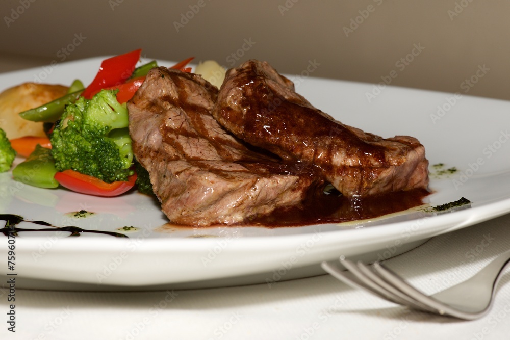 Close-up of filet mignon steak with vegetables Close-up of filet mignon steak with vegetables