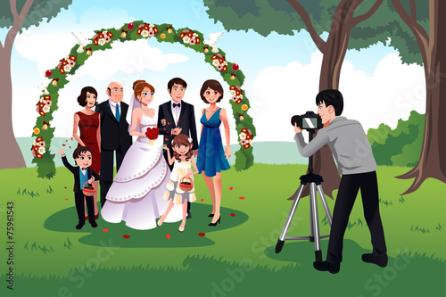 Man photographing a family in a wedding