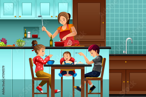 Busy mother in the kitchen with her kids