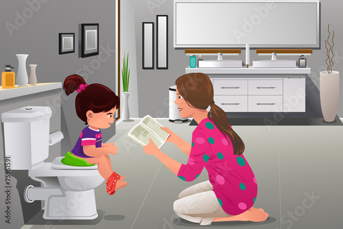 Girl doing potty training with her mother watching