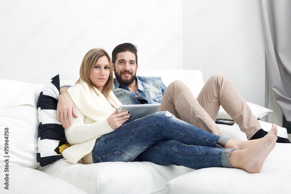 Couple on a couch, browsing